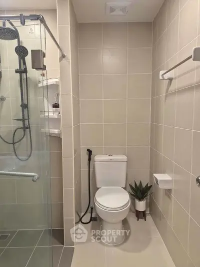 Modern bathroom with glass shower and sleek tile design
