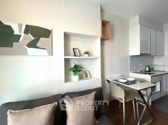 Modern compact living room with integrated kitchen and stylish decor