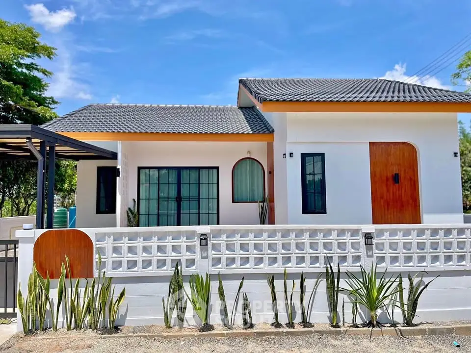 Charming modern house with unique design and lush greenery, perfect for serene living.
