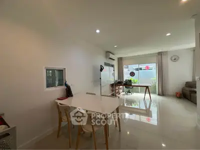 Spacious modern living room with dining area and natural light