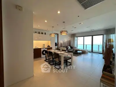 Luxurious open-plan living room with ocean view and modern kitchen