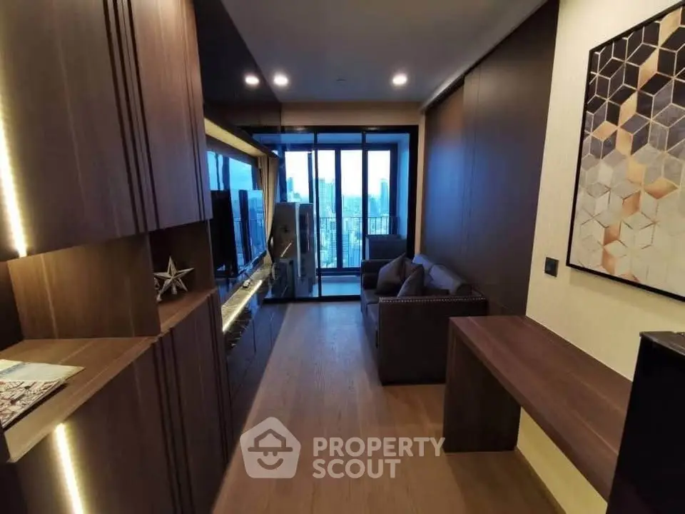 Modern living room with city view and stylish decor in a high-rise apartment.