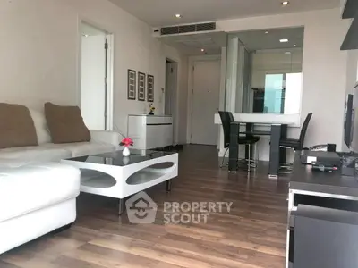 Modern living room with sleek furniture and open layout, perfect for stylish urban living.