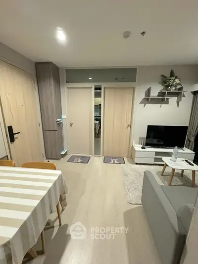Modern living room with stylish decor and cozy seating area in a contemporary apartment.