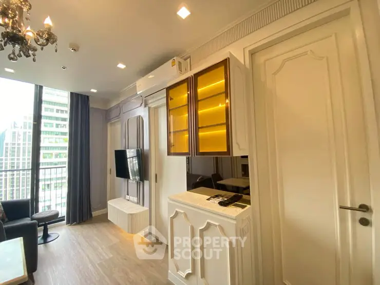 Luxurious modern living room with elegant decor and large windows offering city views.