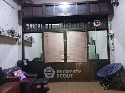 Cozy living room with brown leather sofa and unique wall decor