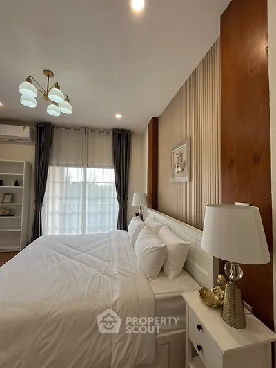 Elegant bedroom with modern decor and natural light