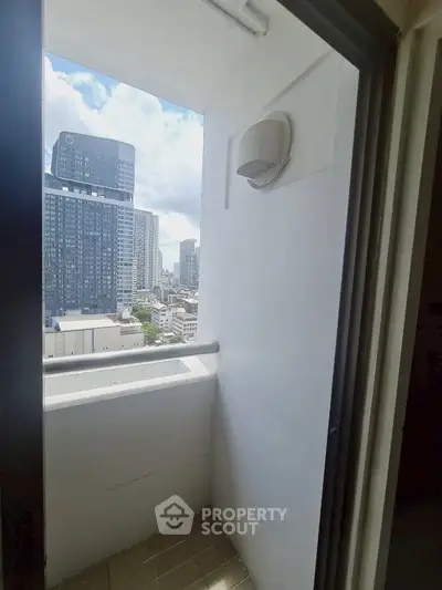 Charming urban balcony with stunning cityscape views, perfect for relaxation and enjoying the skyline.