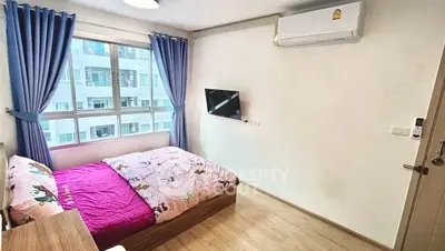 Cozy bedroom with modern decor and natural light in urban apartment