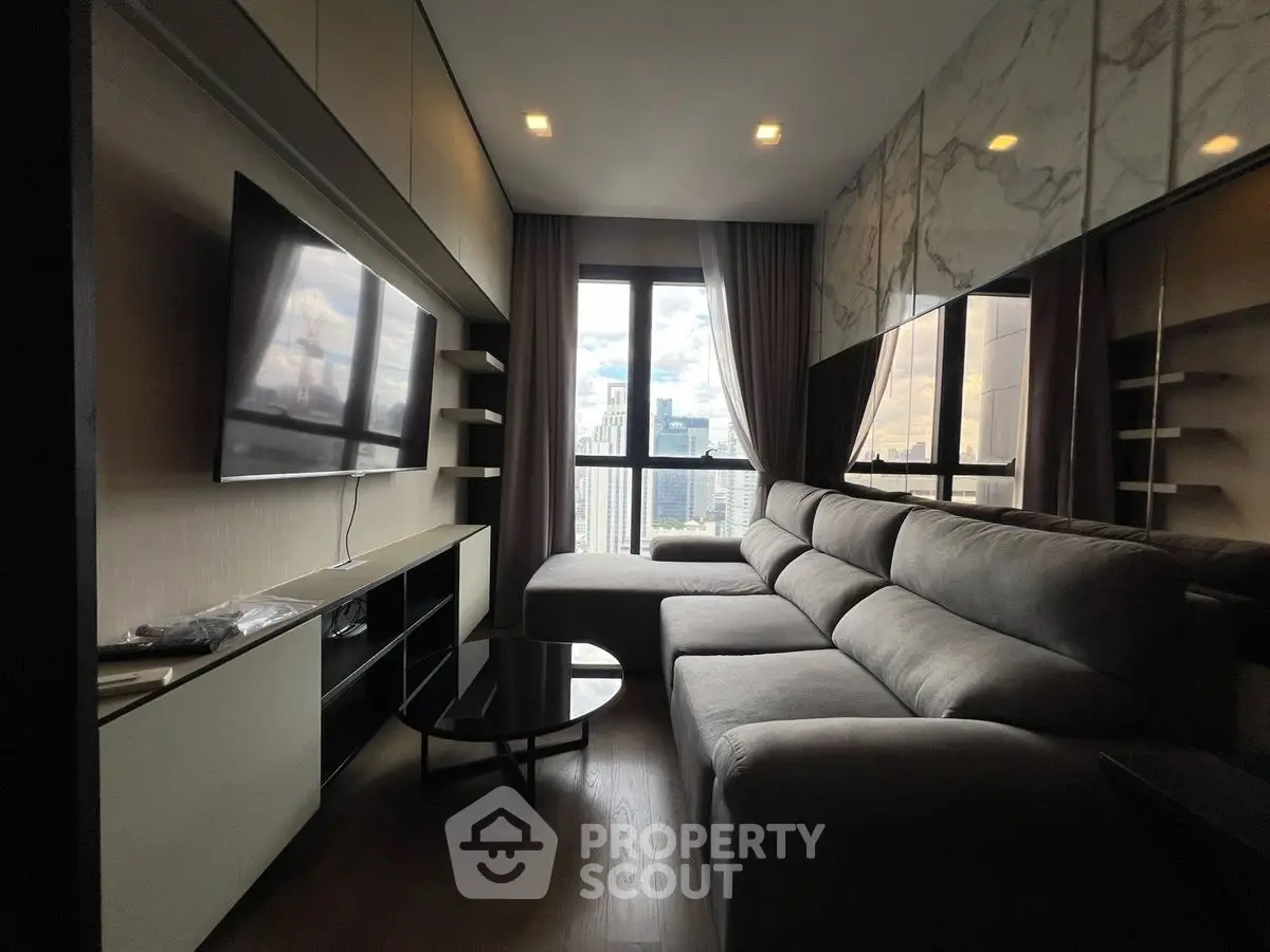 Modern living room with city view, sleek furniture, and large windows.