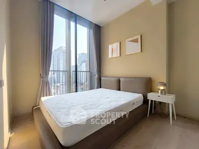 Bright and modern bedroom with city view and stylish decor