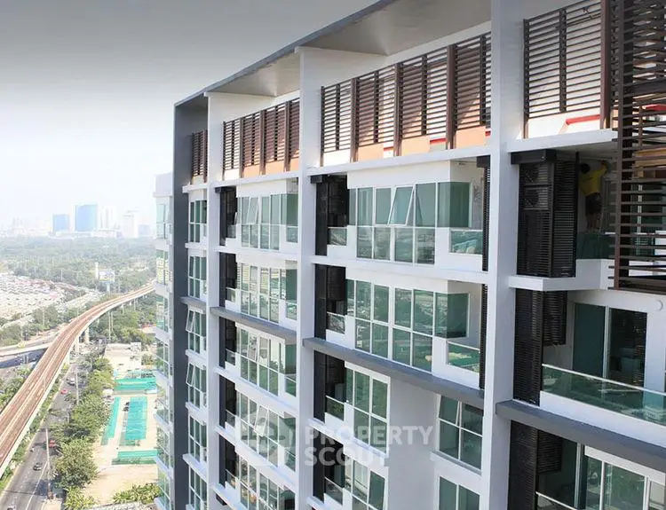 Modern high-rise building with expansive city views and sleek architectural design.