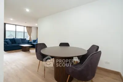 Spacious modern living room with elegant dining area and stylish furniture