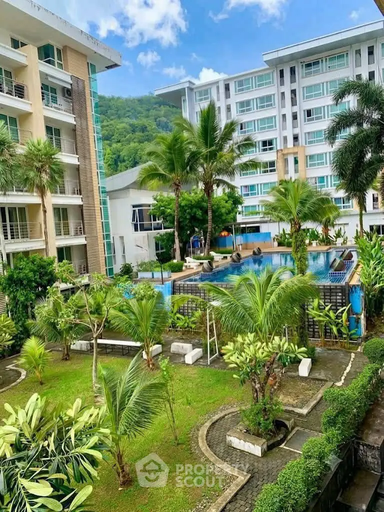 Luxurious condominium with lush garden and pool view, perfect for resort-style living.