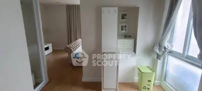 Bright and cozy apartment interior with wooden flooring and stylish furniture, perfect for modern living.