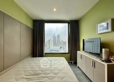 Modern bedroom with city view, featuring a large window, sleek furniture, and stylish decor.
