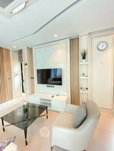 Modern living room with sleek TV setup and elegant decor
