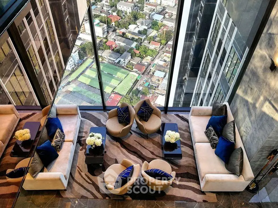 Luxurious high-rise living room with stunning city view and elegant decor.