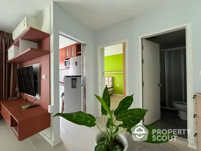 Modern apartment interior with open layout, featuring a kitchen, living area, and stylish decor.