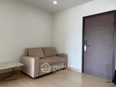 Cozy living room with modern sofa and sleek wooden door