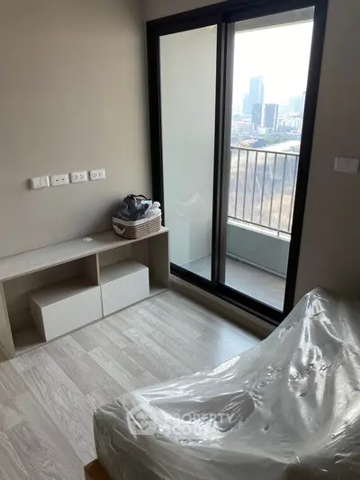 Modern bedroom with balcony view in urban apartment