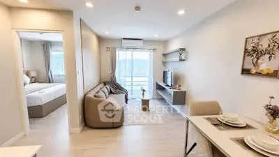 Modern living room with cozy sofa and dining area in stylish apartment