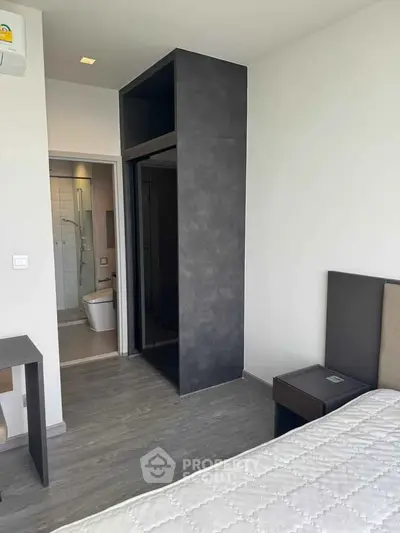 Modern bedroom with ensuite bathroom and sleek design