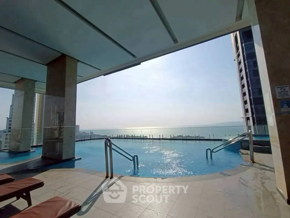 Luxurious rooftop pool with stunning ocean view in high-rise building