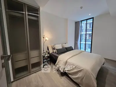 Modern bedroom with sleek design and ample natural light