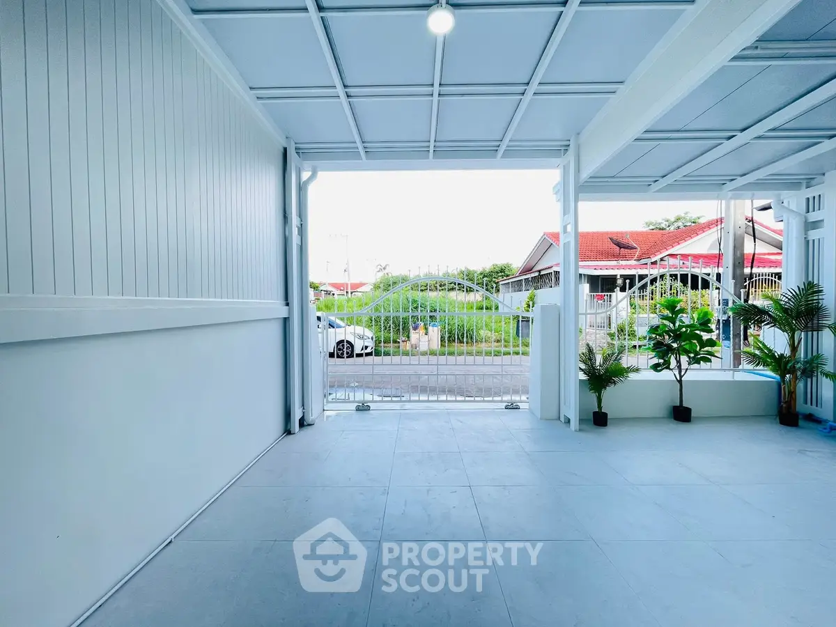 Spacious covered parking area with modern design and natural light