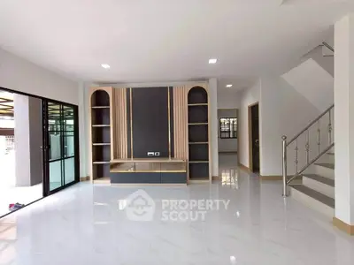 Spacious modern living room with sleek design and ample natural light