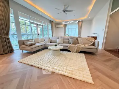 Luxurious living room with modern decor and large windows