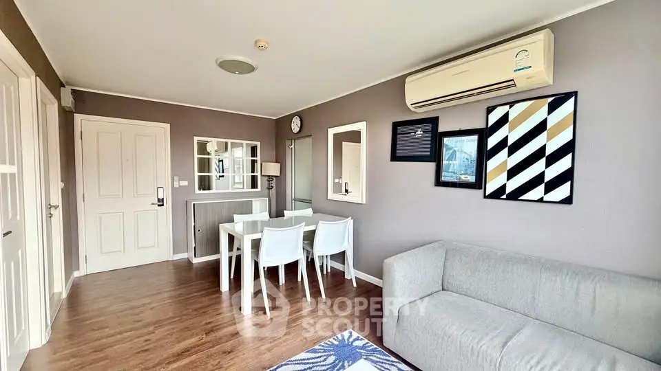 Modern living room with stylish decor and air conditioning in a cozy apartment.