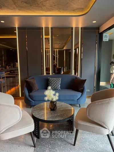 Modern living room with stylish blue sofa and elegant decor