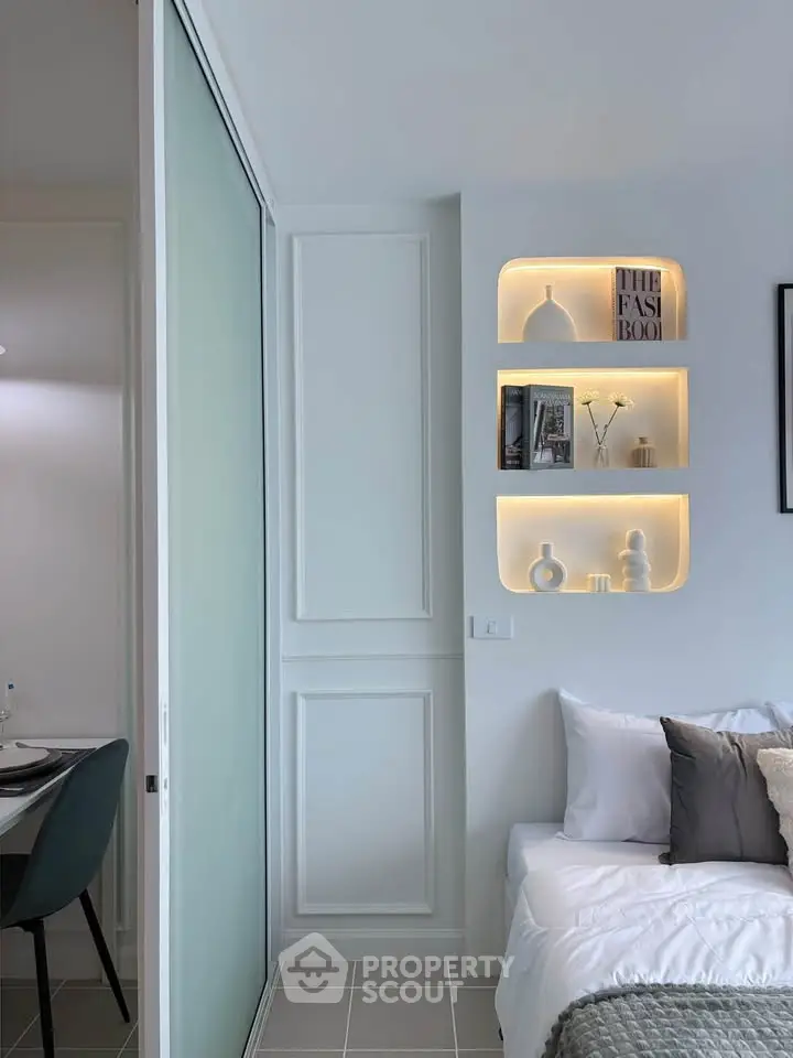 Modern bedroom with stylish built-in shelves and cozy decor