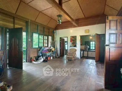 Charming rustic living room with wooden floors and cozy decor, perfect for a serene lifestyle.