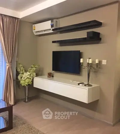 Modern living room with sleek TV setup and elegant decor