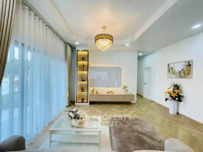 Luxurious living room with elegant chandelier and modern decor