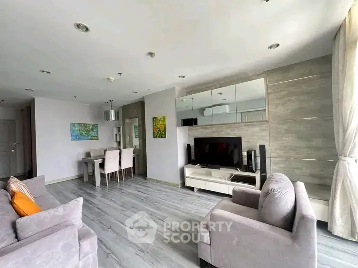 Spacious modern living room with stylish decor and ample natural light