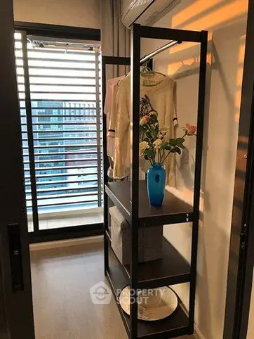 Modern apartment with stylish storage and city view from balcony.