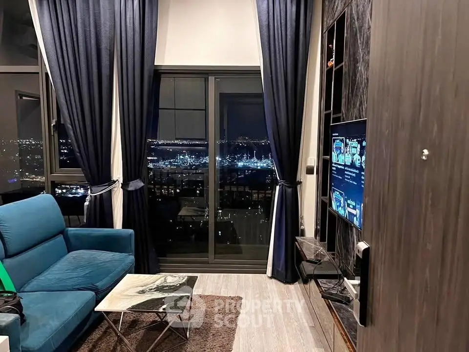 Luxurious living room with stunning night city view, modern decor, and elegant furnishings.