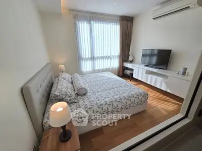 Modern bedroom with stylish decor and natural light