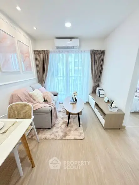 Chic modern living room with cozy decor and natural light, perfect for relaxation and entertaining.