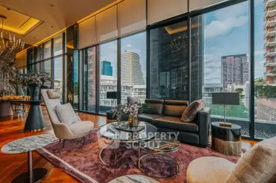 Luxurious living room with panoramic city views and elegant modern decor.