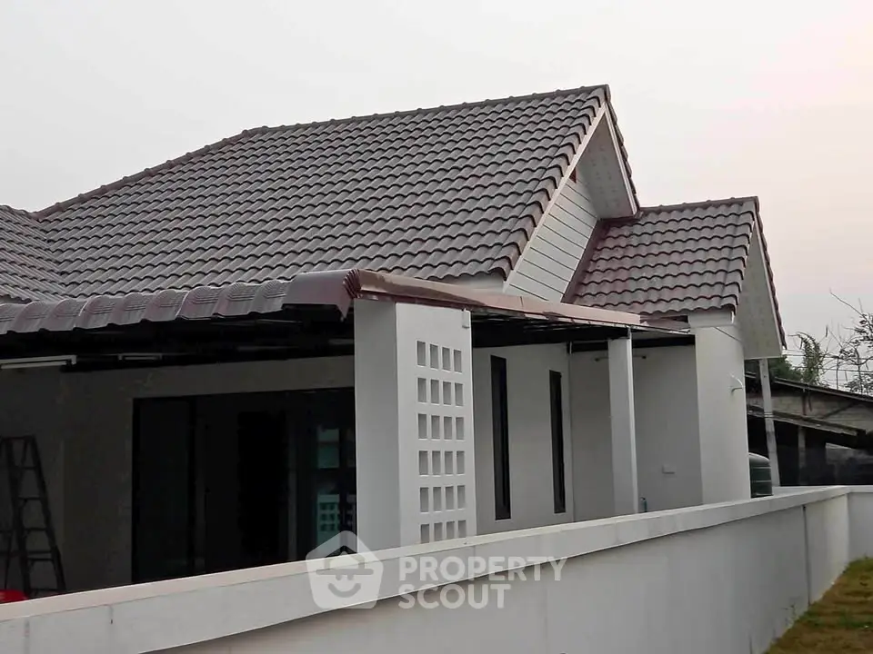 Charming suburban home with modern roof design and spacious exterior