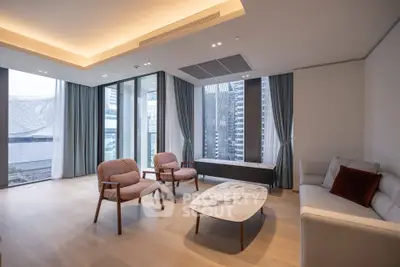 Luxurious modern living room with panoramic city views and elegant furnishings.
