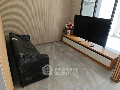 Modern living room with sleek TV setup and stylish decor