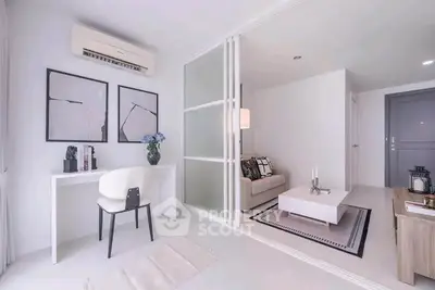 Modern living room with stylish decor and open layout, featuring a cozy seating area and elegant workspace.