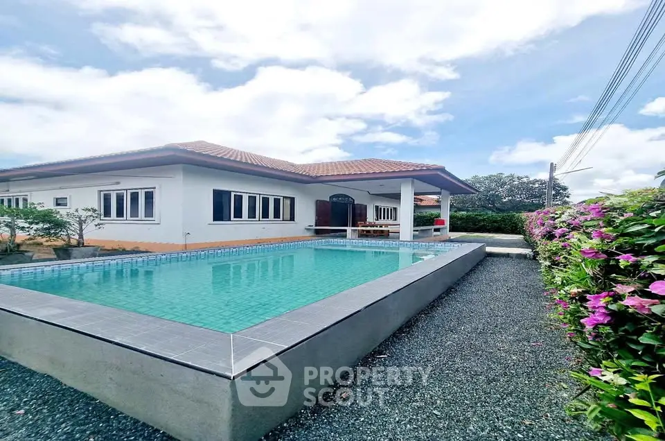 Charming single-story home with private pool and lush garden, perfect for relaxation and entertaining.
