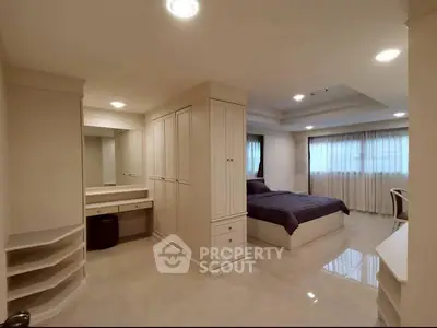 Spacious bedroom with elegant design and ample storage